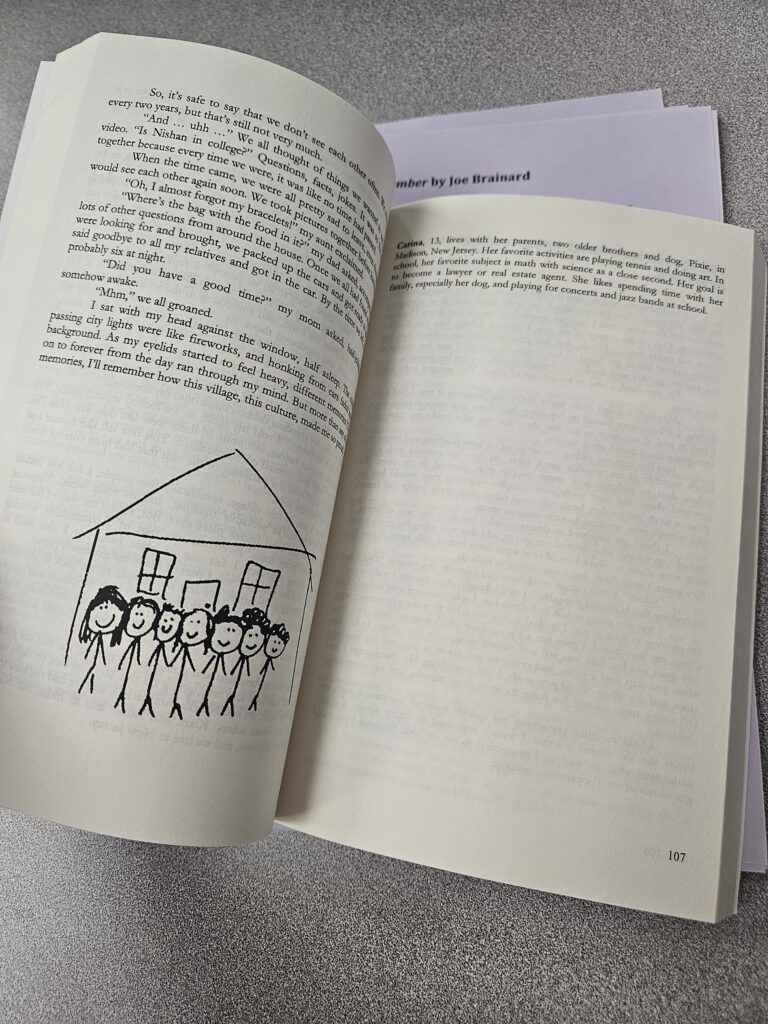 Inside of a book with a drawing of a house.